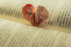 red and white cube on book page